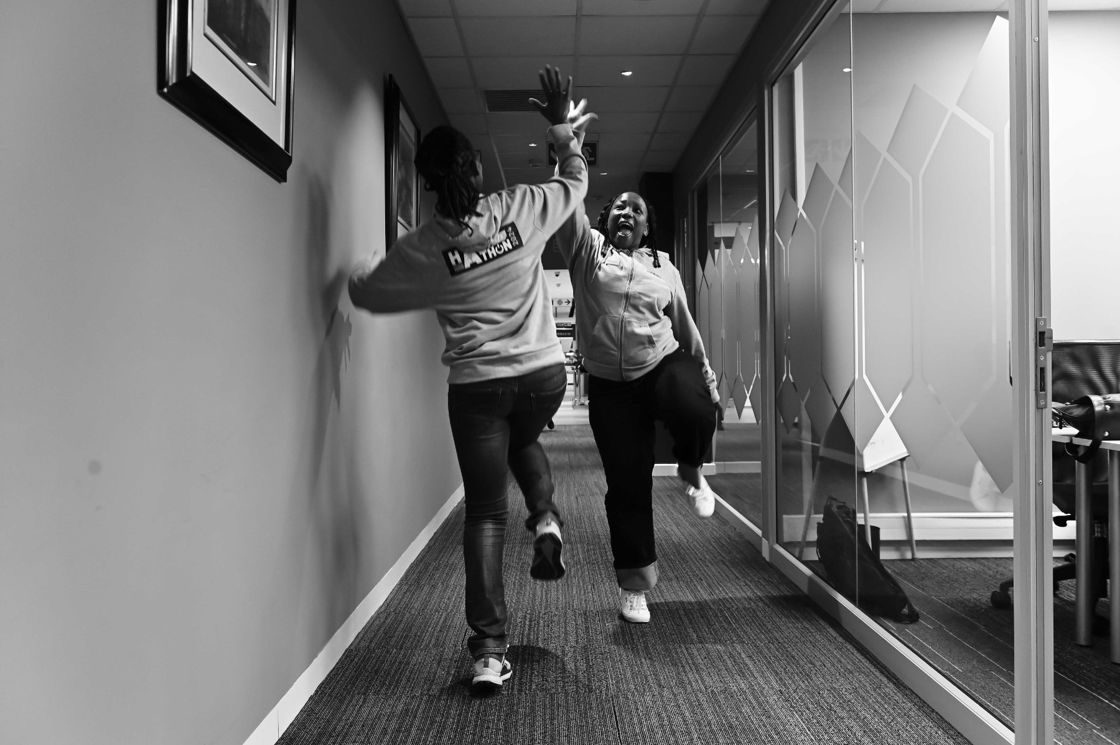 Hackathon participants celebrating in a corridor